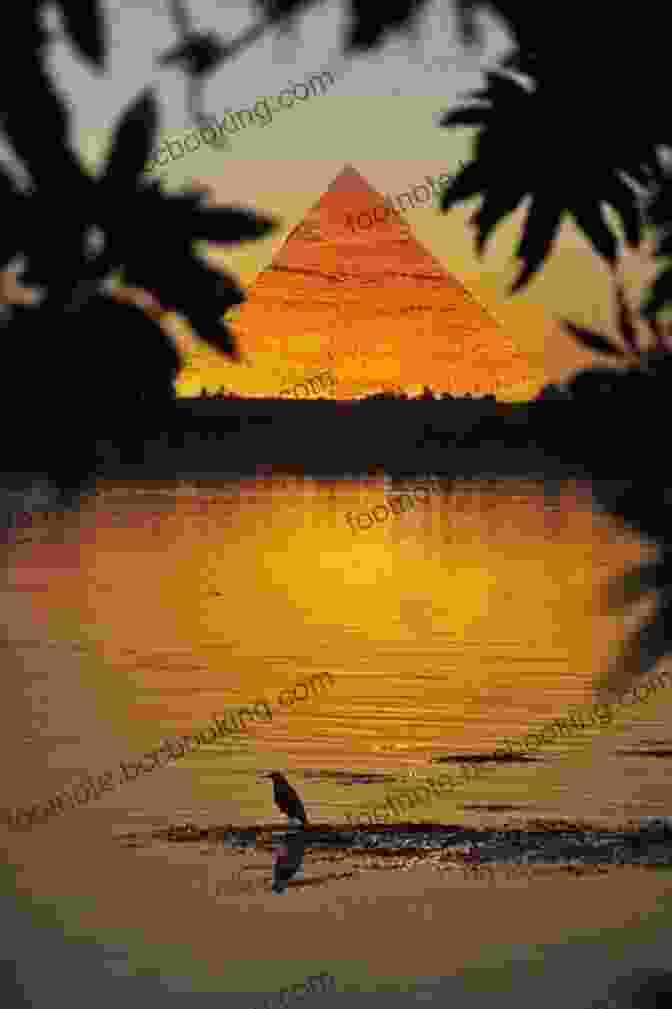 A Breathtaking Sunset Over The Nile River, With The Pyramids Of Giza In The Distance A Thousand Miles Up The Nile