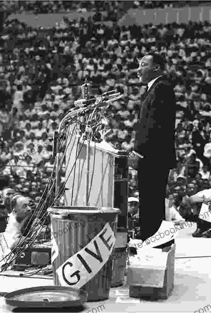 A Historic Photograph Of The Leader Addressing A Rally, Their Voice Resonating With Passion And Conviction. Mahatma Gandhi The Man Who Became One With The Universal Being: Biography Of The Famous Indian Leader