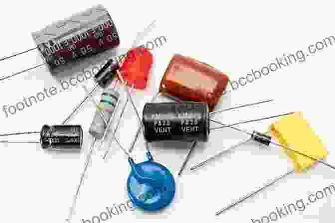 An Assortment Of Electronic Components, Such As Resistors, Capacitors, LEDs, And Transistors, Displayed On A Table. Make Electronic Circuits On Paper With Pencil: Build Simple Basic Electronic Circuits