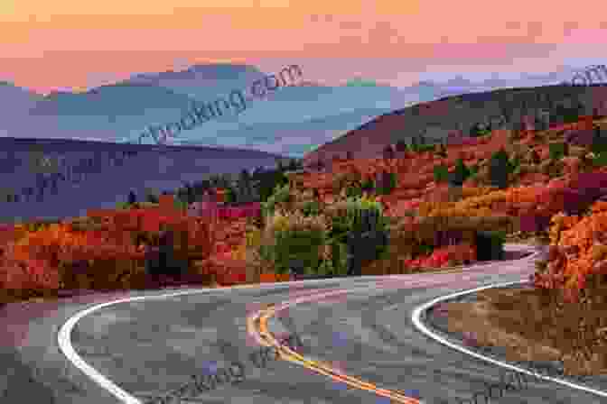 Colorful Fall Foliage In Vermont's Mountains, With Rolling Hills And A Winding Road Leading Into The Distance Fodor S Maine Vermont New Hampshire: With The Best Fall Foliage Drives And Scenic Road Trips (Full Color Travel Guide)